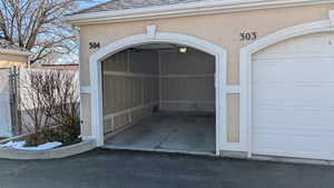 Garage featuring fence