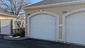 Garage featuring fence