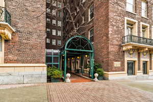 Property entrance with brick siding