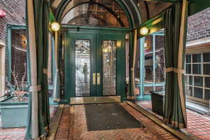 Property entrance featuring french doors