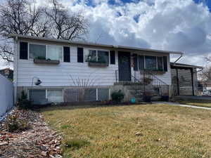 View of front of home featuring a front lawn