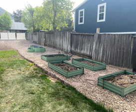View of yard with a vegetable garden and fence private yard