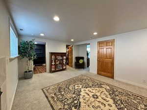 Interior space with recessed lighting, baseboards, and carpet