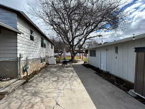 View of patio / terrace with cooling unit and fence