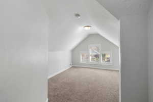 Upstairs bedroom with front-facing windows and closet.