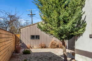 Backyard space on the south side with newer paved paths and water-wise landscaping.