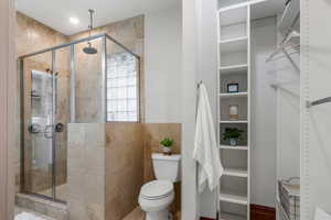 Bathroom features a beautiful glass window bringing natural light into the space.