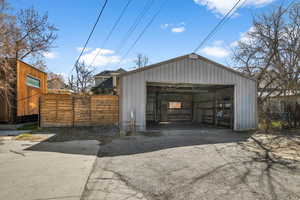 Entrance to the garage from the west side. From the back gate, you can access Westminster Park to the left.