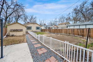 Exterior space featuring a patio and a fenced backyard