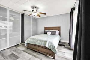 Bedroom with a ceiling fan and lots of closet space!