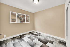 Bedroom with baseboards and wood finished floors