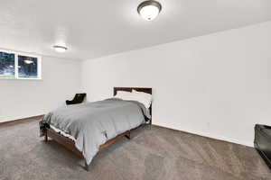 Bedroom featuring baseboards and carpet flooring