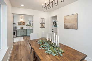 Dining space with dark wood finished floors and a textured ceiling