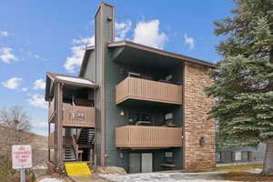 View of building exterior featuring stairway