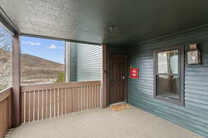 View of exterior entry with a mountain view