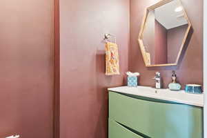 Bathroom featuring visible vents and vanity