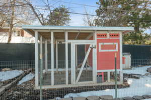 View of poultry coop with fence