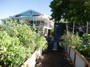 View of property exterior with, vegetable garden, in the fall