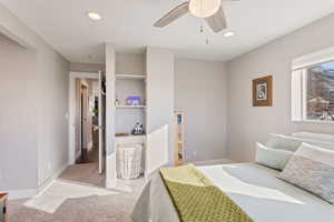 Bedroom with recessed lighting, baseboards, light colored carpet, and ceiling fan