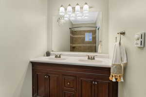 Primary Bathroom with dual vanity and jetted tub