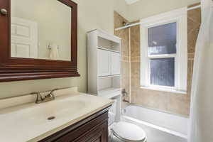 Full bathroom with shower / bathtub combination