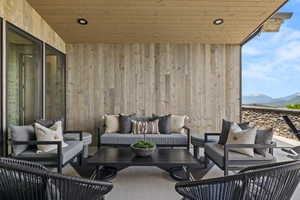 View of patio with outdoor lounge area and a mountain view