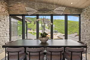 Dining area featuring wood ceiling, recessed lighting, and high vaulted ceiling