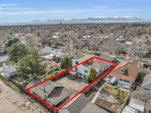 Birds eye view of property with a residential view and a mountain view