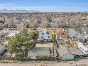 Birds eye view of property featuring a mountain view and a residential view