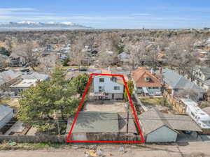 Birds eye view of property featuring a residential view and a mountain view