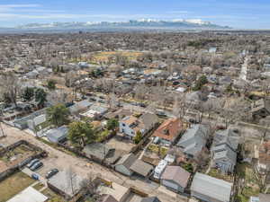 Birds eye view of property with a mountain view and a residential view