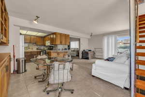 Dining space featuring light tile patterned floors