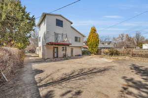 Back of house with fence