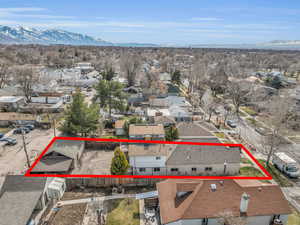 Birds eye view of property featuring a residential view and a mountain view