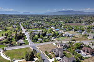 Aerial perspective of suburban area with a mountainous background