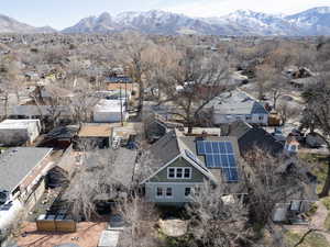 Birds eye view of property with a residential view and a mountain view