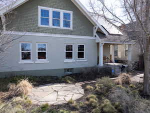 View of side of property with stucco siding