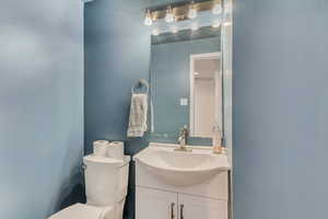 Bathroom featuring vanity and toilet