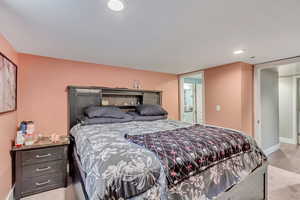 Bedroom with recessed lighting and baseboards