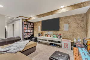 Carpeted living area featuring recessed lighting