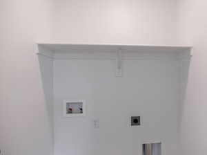Laundry area featuring washer hookup and electric dryer hookup