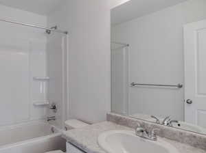 Full bath featuring vanity, toilet, and tub / shower combination
