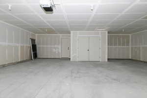 Garage featuring a garage door opener