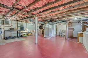 Unfinished basement featuring stairway