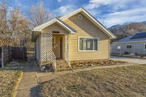 Bungalow-style house with a mountain view and fence