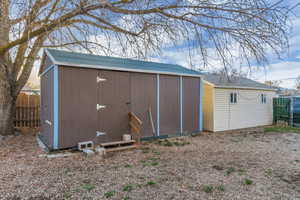 View of shed with fence