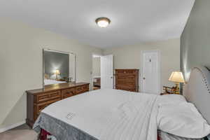 Carpeted bedroom with baseboards