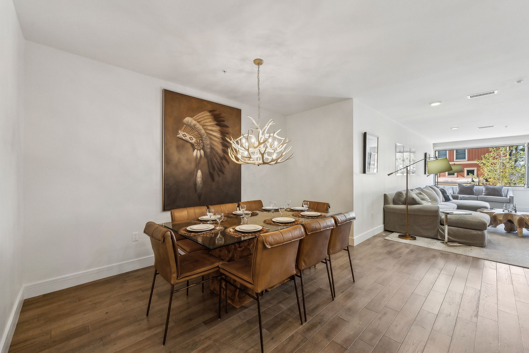 Dining room featuring visible vents, baseboards, an inviting chandelier, and wood finished floors