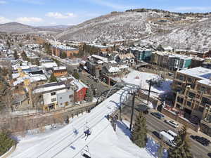 Snowy aerial view featuring a mountain view