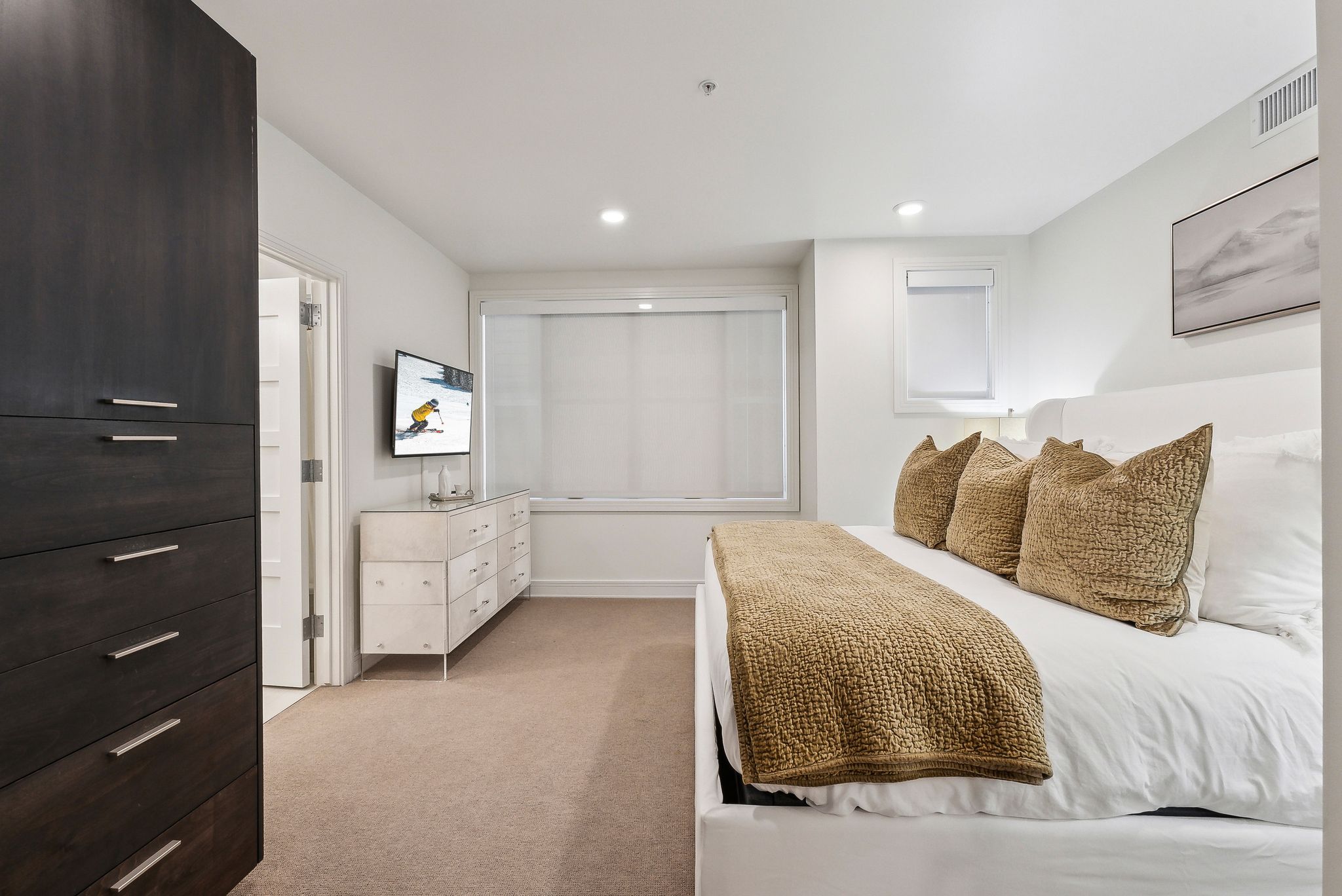 Bedroom featuring recessed lighting, light colored carpet, and visible vents